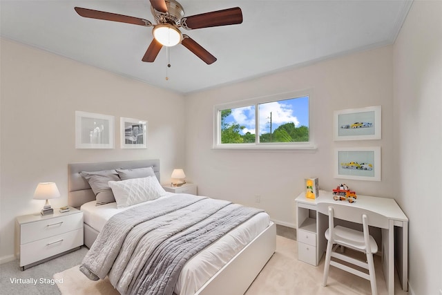bedroom featuring light colored carpet, baseboards, crown molding, and ceiling fan