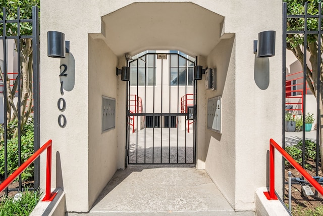 2100 Huldy St Unit 4, Houston, TX 77019 - property entrance featuring stucco siding and a gate