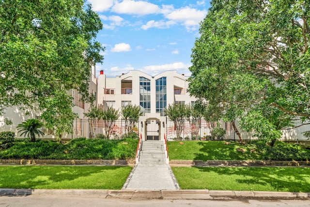 2100 Huldy St Unit 4, Houston, TX 77019 - view of building exterior with a fenced front yard