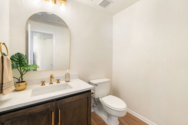 2100 Huldy St Unit 4, Houston, TX 77019 - half bathroom with wood finished floors, toilet, vanity, and baseboards