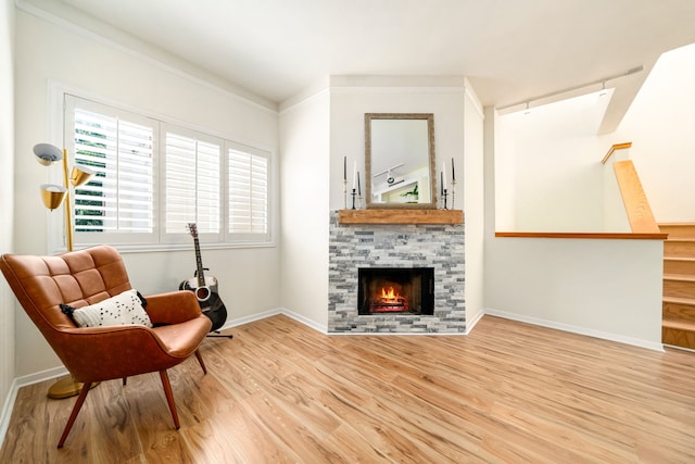 2100 Huldy St Unit 4, Houston, TX 77019 - sitting room with wood finished floors, a fireplace, baseboards, and track lighting
