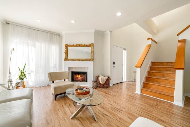 2100 Huldy St Unit 4, Houston, TX 77019 - living room with stairs, a warm lit fireplace, wood finished floors, and recessed lighting