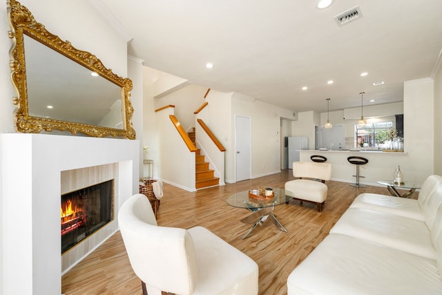2100 Huldy St Unit 4, Houston, TX 77019 - living room with wood finished floors, recessed lighting, stairway, a warm lit fireplace, and baseboards
