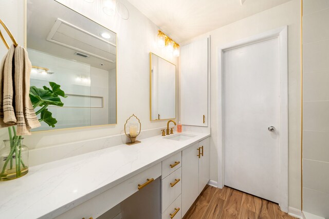2100 Huldy St Unit 4, Houston, TX 77019 - bathroom with wood finished floors and vanity