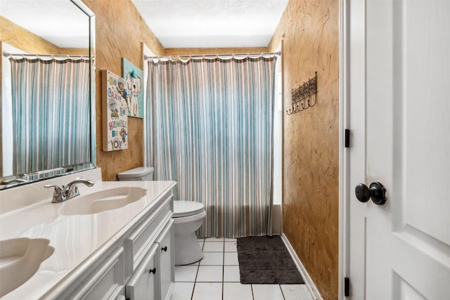 2112 Shadow Bay Cir, League City, TX 77573 - full bath featuring toilet, tile patterned floors, vanity, a textured ceiling, and baseboards
