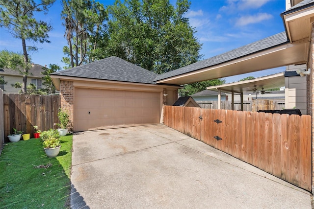 2112 Shadow Bay Cir, League City, TX 77573 - garage featuring concrete driveway and fence