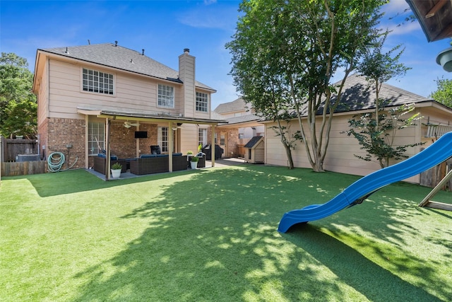 2112 Shadow Bay Cir, League City, TX 77573 - rear view of property featuring outdoor lounge area, a playground, brick siding, a chimney, and ceiling fan