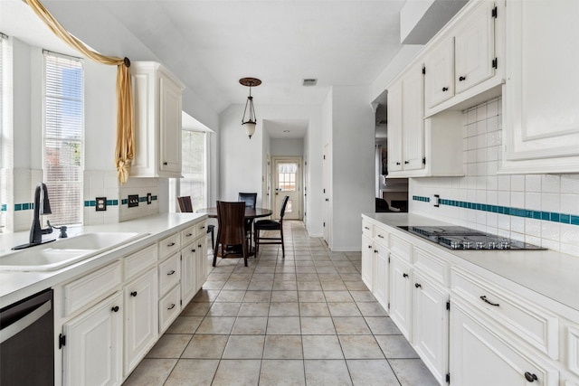 2112 Shadow Bay Cir, League City, TX 77573 - kitchen with a sink, black electric cooktop, dishwasher, backsplash, and light tile patterned flooring