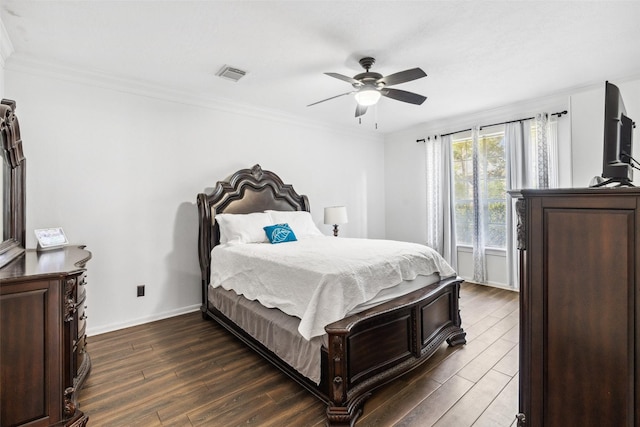 2112 Shadow Bay Cir, League City, TX 77573 - bedroom featuring dark wood finished floors, crown molding, baseboards, and a ceiling fan