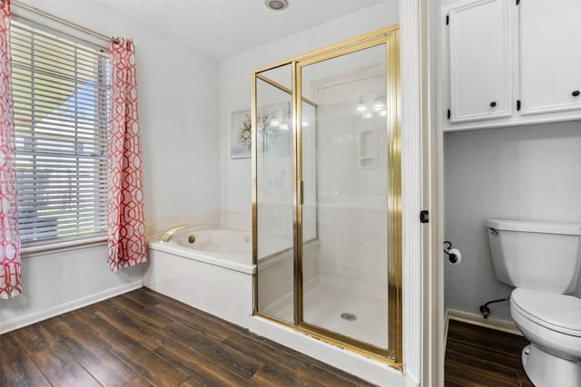 2112 Shadow Bay Cir, League City, TX 77573 - bathroom featuring wood finished floors, toilet, baseboards, and a garden tub