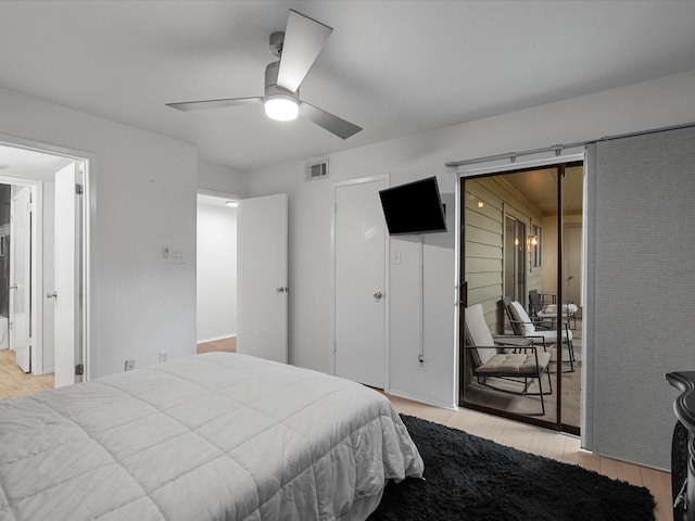 bedroom featuring light wood-style floors and a ceiling fan