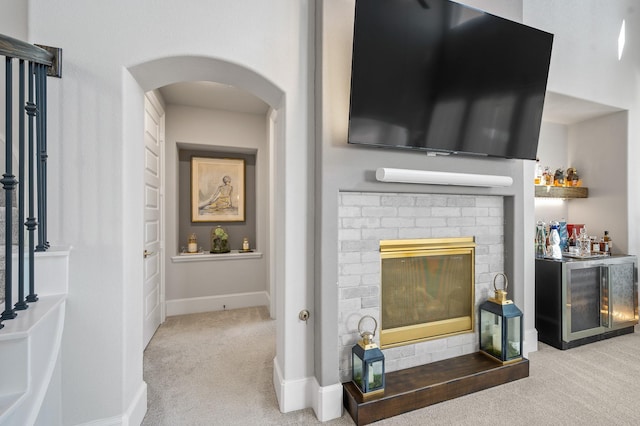 2723 Camellia Ave, Brookshire, TX 77423 - detailed view of carpet, arched walkways, a dry bar, wine cooler, and baseboards