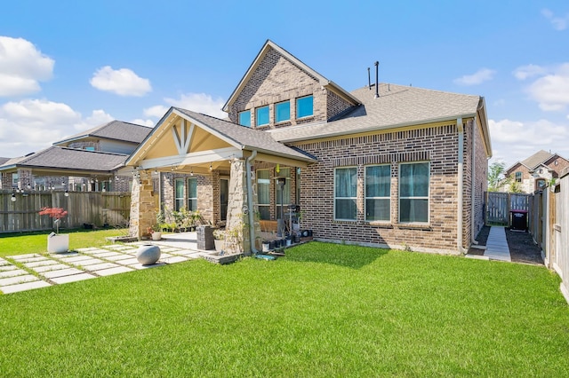 2723 Camellia Ave, Brookshire, TX 77423 - rear view of property with brick siding, a patio, and a shingled roof