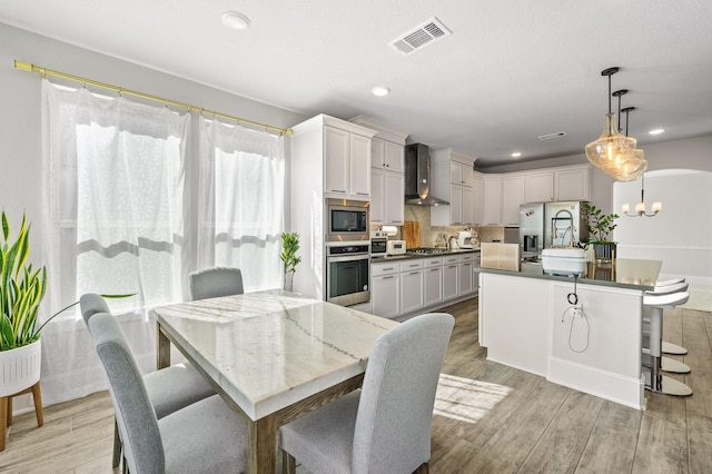 2723 Camellia Ave, Brookshire, TX 77423 - dining space with a chandelier, light wood-style floors, and recessed lighting