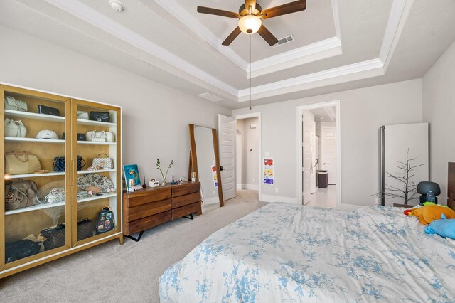 2723 Camellia Ave, Brookshire, TX 77423 - carpeted bedroom featuring a raised ceiling, crown molding, a ceiling fan, connected bathroom, and baseboards