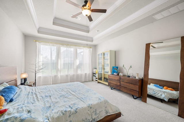 2723 Camellia Ave, Brookshire, TX 77423 - carpeted bedroom featuring a tray ceiling, ornamental molding, and a ceiling fan