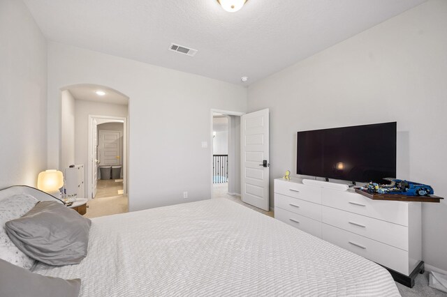 2723 Camellia Ave, Brookshire, TX 77423 - carpeted bedroom with arched walkways and baseboards