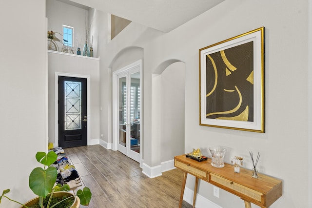 2723 Camellia Ave, Brookshire, TX 77423 - entryway with french doors, wood finished floors, baseboards, and healthy amount of natural light