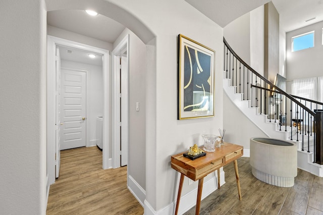 2723 Camellia Ave, Brookshire, TX 77423 - hall featuring arched walkways, wood finished floors, baseboards, stairs, and recessed lighting