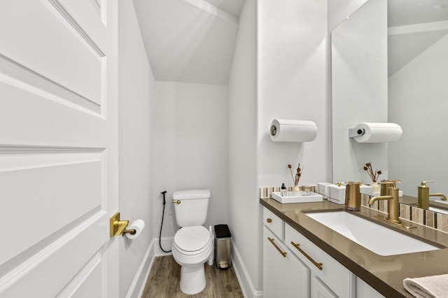 2723 Camellia Ave, Brookshire, TX 77423 - half bathroom featuring toilet, wood finished floors, vanity, and baseboards