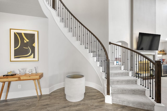 2723 Camellia Ave, Brookshire, TX 77423 - staircase with wood finished floors, baseboards, and a high ceiling
