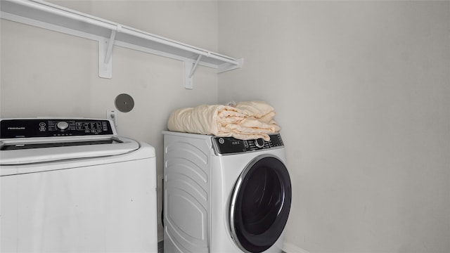 22218 Delphin Grove Dr, Hockley, TX 77447 - clothes washing area with independent washer and dryer