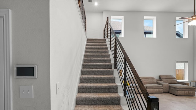 22218 Delphin Grove Dr, Hockley, TX 77447 - stairway featuring a high ceiling and a ceiling fan