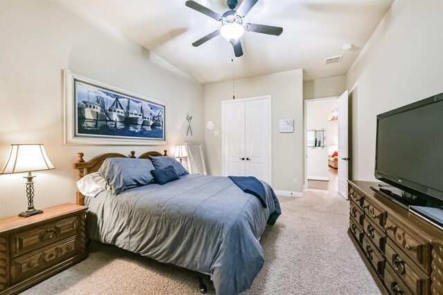 bedroom with light carpet, a ceiling fan, a closet, and baseboards