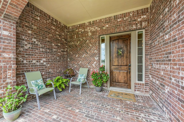entrance to property with brick siding