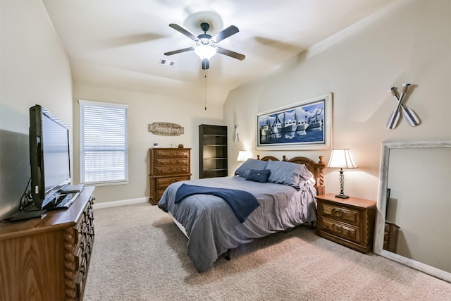 bedroom featuring light carpet, baseboards, and a ceiling fan