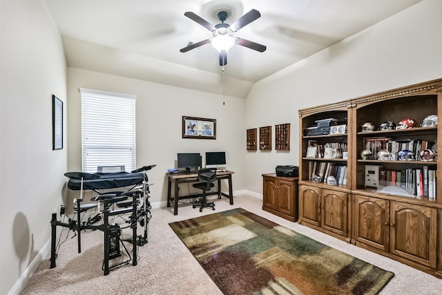 home office featuring carpet, a ceiling fan, baseboards, and lofted ceiling