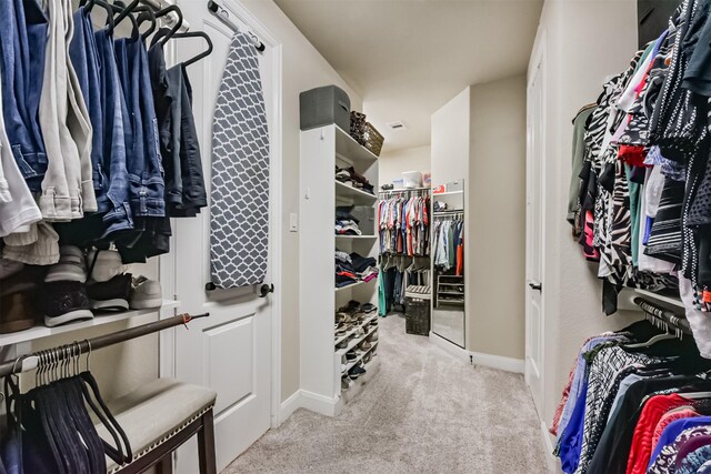 spacious closet with carpet