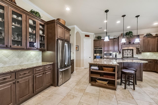 kitchen with stainless steel appliances, arched walkways, open shelves, dark brown cabinets, and tasteful backsplash