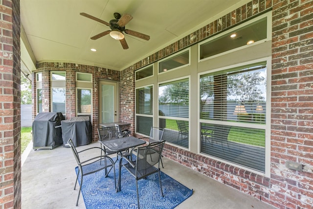 view of patio / terrace featuring a ceiling fan, outdoor dining area, and area for grilling