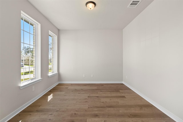3021 Pampaneria Dr, Conroe, TX 77301 - unfurnished room with wood finished floors and baseboards