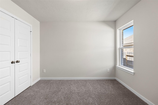 3021 Pampaneria Dr, Conroe, TX 77301 - unfurnished bedroom with carpet flooring, baseboards, and a closet