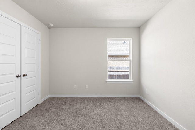 3021 Pampaneria Dr, Conroe, TX 77301 - unfurnished bedroom featuring carpet floors, a closet, and baseboards