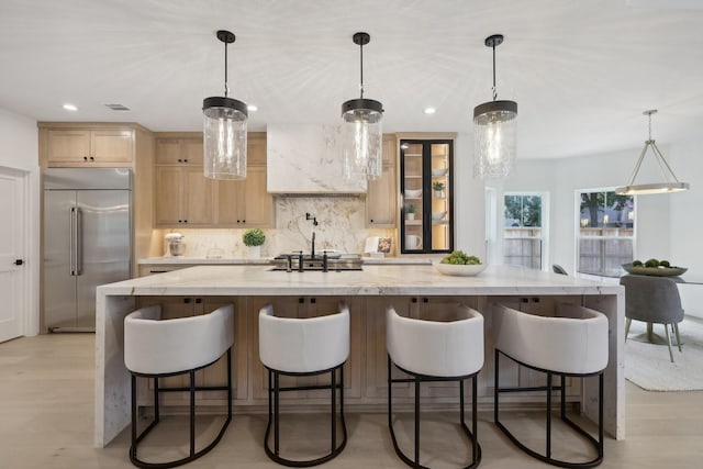 6291/2 Rancho Bauer Dr, Houston, TX 77079 - kitchen with built in refrigerator, decorative backsplash, a large island, recessed lighting, and light brown cabinetry