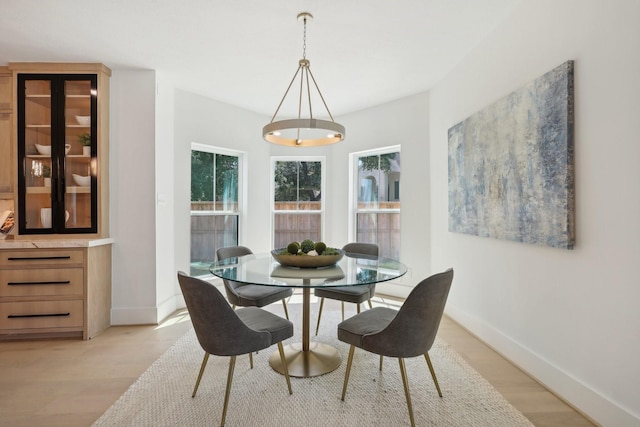 6291/2 Rancho Bauer Dr, Houston, TX 77079 - dining space with light wood-style flooring and baseboards