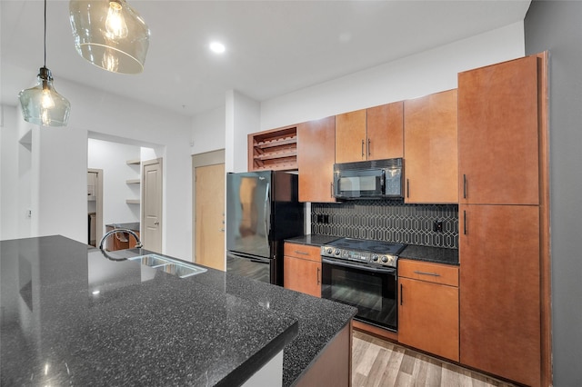 kitchen featuring black appliances, open shelves, a sink, tasteful backsplash, and pendant lighting