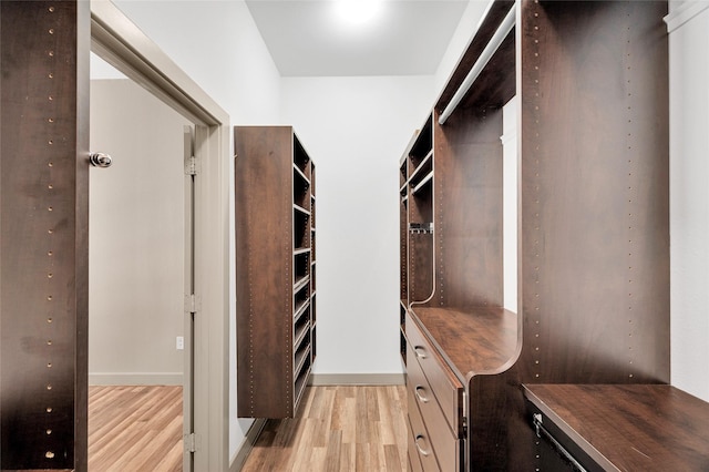 spacious closet featuring light wood-style floors