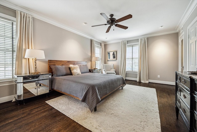 bedroom featuring baseboards, dark wood finished floors, crown molding, and a ceiling fan