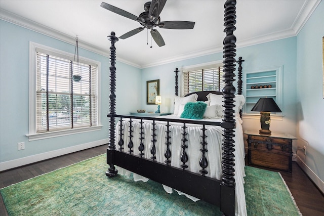 bedroom featuring baseboards, wood finished floors, ornamental molding, and a ceiling fan