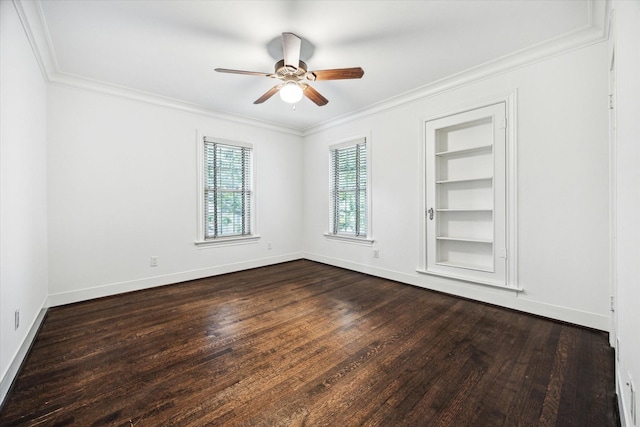 unfurnished room featuring built in features, ornamental molding, a ceiling fan, and baseboards