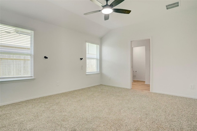 12319 Tranquil Pines Dr, Houston, TX 77014 - empty room featuring light colored carpet, a ceiling fan, baseboards, and lofted ceiling