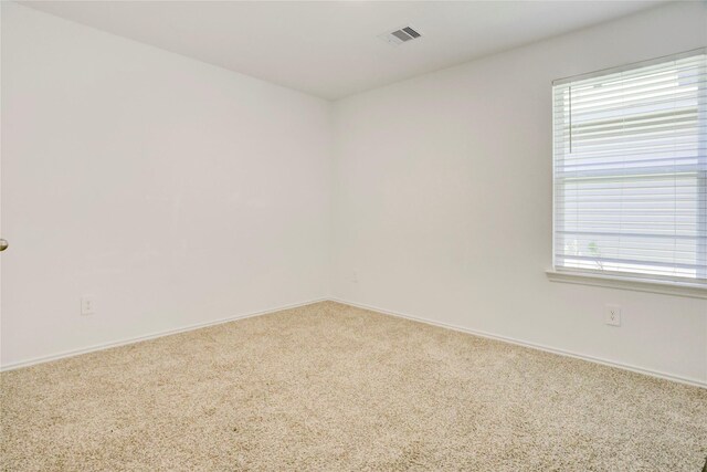 12319 Tranquil Pines Dr, Houston, TX 77014 - unfurnished room with carpet, plenty of natural light, and baseboards
