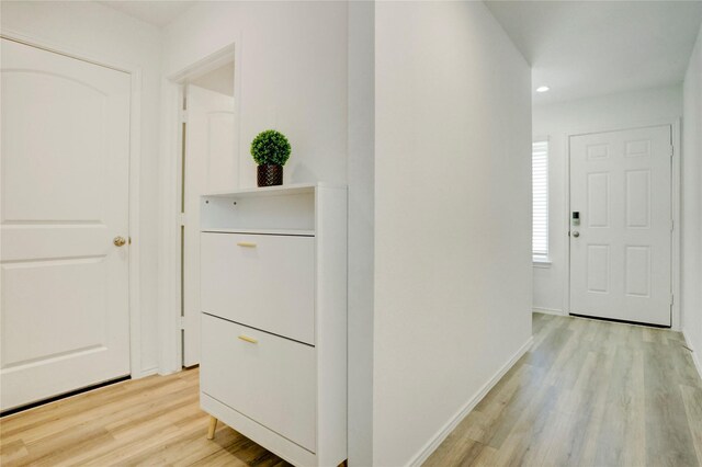12319 Tranquil Pines Dr, Houston, TX 77014 - hall featuring light wood-type flooring, baseboards, and recessed lighting