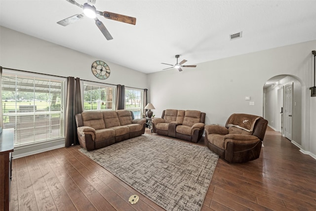 996 Scroggins Ln, Waller, TX 77484 - living room with ceiling fan, arched walkways, lofted ceiling, dark wood-style flooring, and baseboards