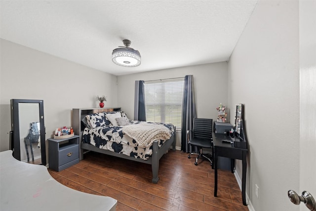 996 Scroggins Ln, Waller, TX 77484 - bedroom with dark wood finished floors and baseboards