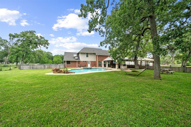 996 Scroggins Ln, Waller, TX 77484 - back of property featuring brick siding